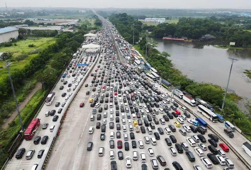 General view of a traffic jam at a toll booth of a highway as Indonesian Muslims going back to their hometown for celebrating Eid al-Fitr known locally as ‘Mudik’ in Karawang Regency, on the outskirts of Jakarta