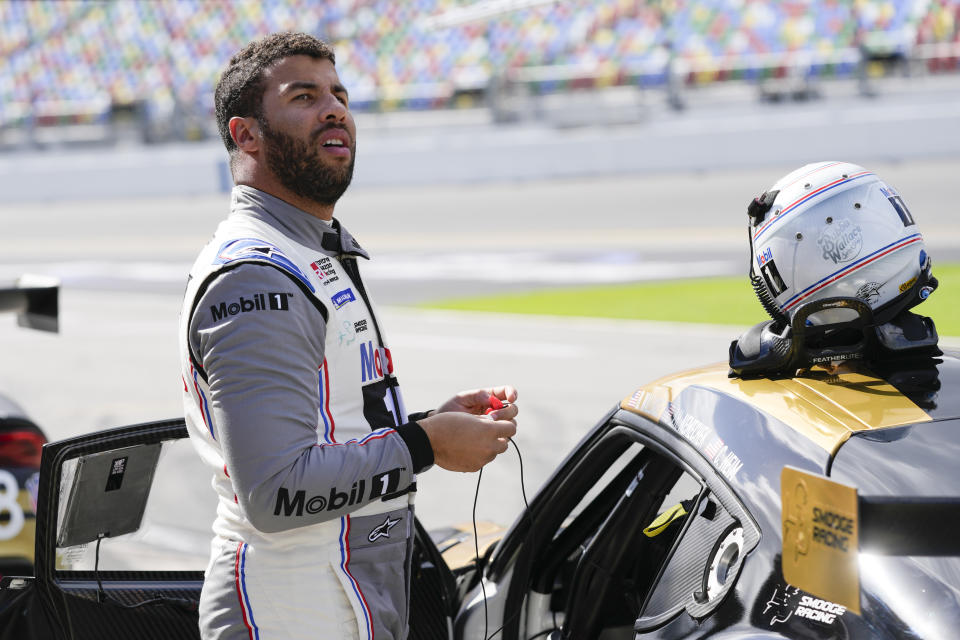 Bubba Wallace prepares for a qualifying run for the Michelin Pilot Challenge auto race at Daytona International Speedway, Thursday, Jan. 25, 2024, in Daytona Beach, Fla. (AP Photo/John Raoux)