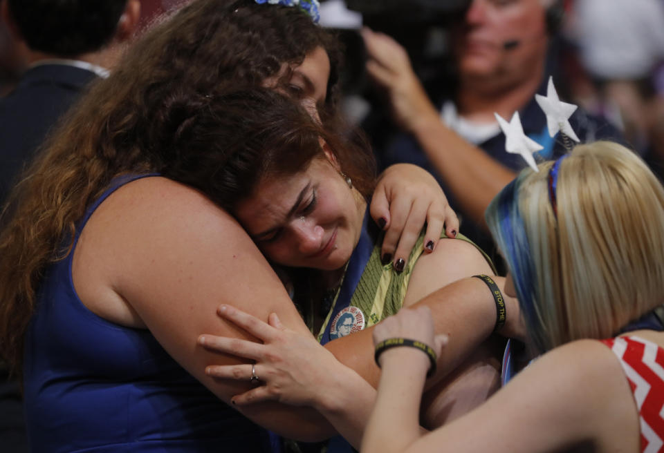 <p>Supporters of former Democratic U.S. presidential candidate Senator Bernie Sanders hug and cry at the end of Sanders’ speech during the first session at the Democratic National Convention in Philadelphia, Pennsylvania on July 25, 2016. (REUTERS/Jim Young)</p>
