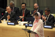 FILE- In this file photo dated Friday, July 12, 2013, United Nations Secretary-General Ban Ki-moon, left, applauds as Malala Yousafzai addresses the 'Malala Day' Youth Assembly, at United Nations headquarters. In his General Assembly opening address on Tuesday, Sept. 21, 2021, U.N. Secretary-General Antonio Guterres practically scolded world leaders for disappointing young people with a perceived inaction on climate change, inequalities and the lack of educational opportunities, among other issues important to young people. (AP Photo/Mary Altaffer, FILE)