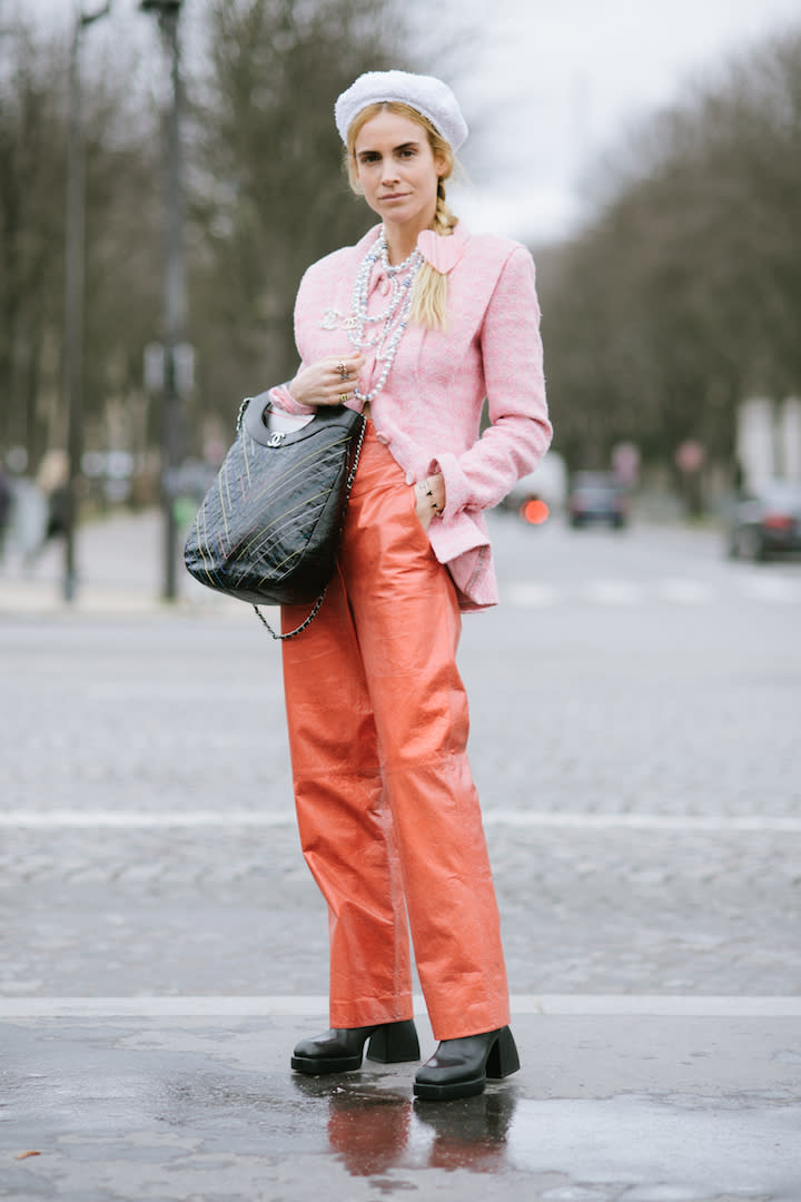 Camila Coelho is seen wearing white blazer and pants, micro bag