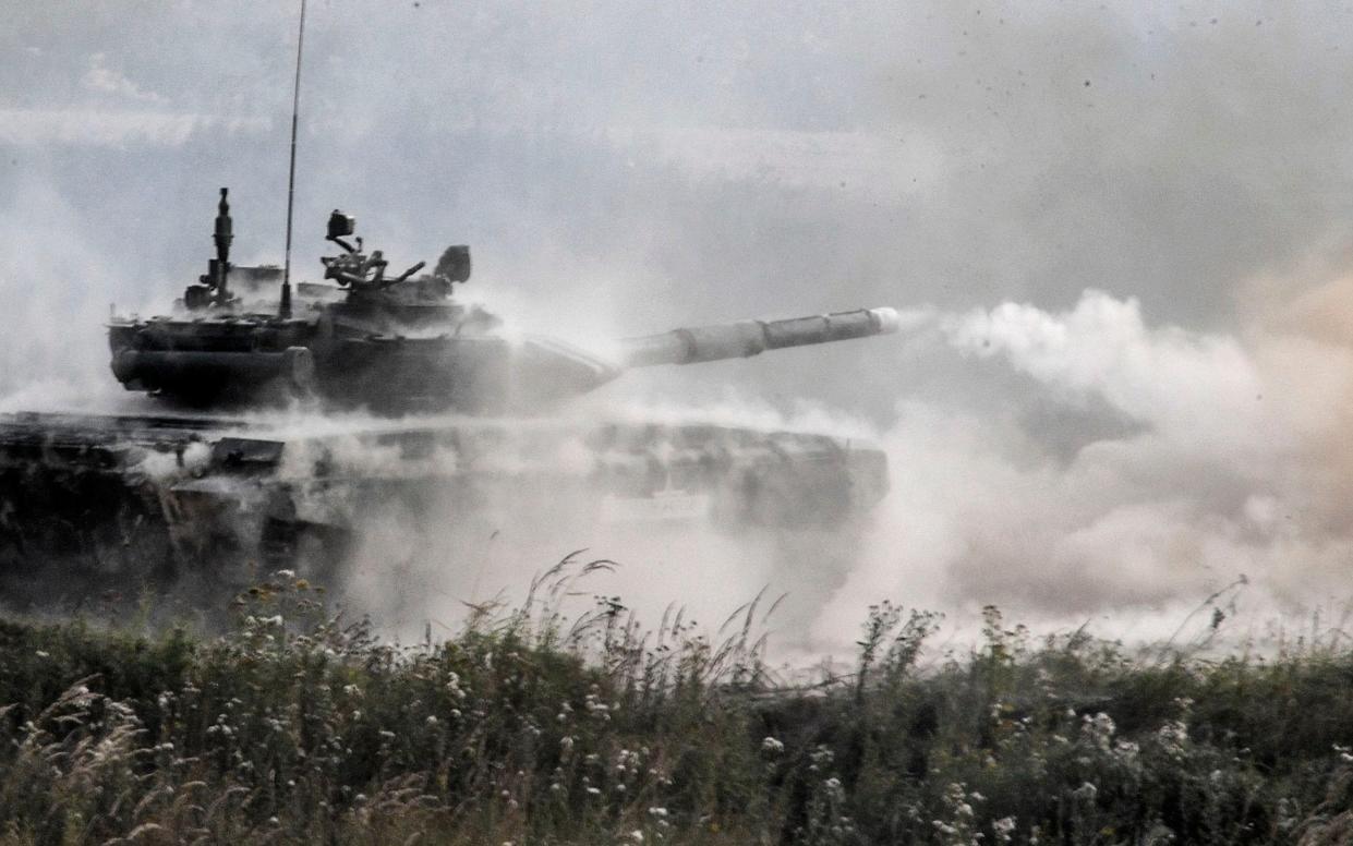 A Russian T-90 tank fires during a training exercise near Moscow - AFP