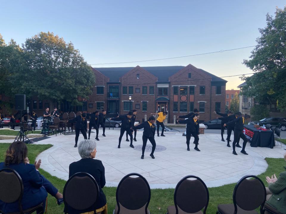 The Isiserettes Drill & Drum Corp perform at Hoyt Sherman Place in Des Moines on Oct. 17, 2023, during the lawn enhancement project ribbon cutting ceremony.