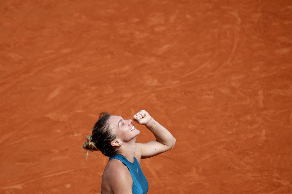 FILE - In this June 9, 2018, file photo, Romania's Simona Halep clenches her fist after defeating Sloane Stephens of the United States during the women's singles final of the French Open tennis tournament at Roland Garros stadium in Paris. (AP Photo/Christophe Ena, File)