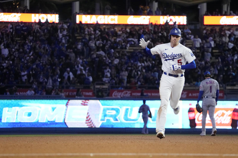 Los Angeles Dodgers' Freddie Freeman heads to third after hitting a two-run home run during the fifth inning of a baseball game against the New York Mets Monday, April 17, 2023, in Los Angeles. (AP Photo/Mark J. Terrill)