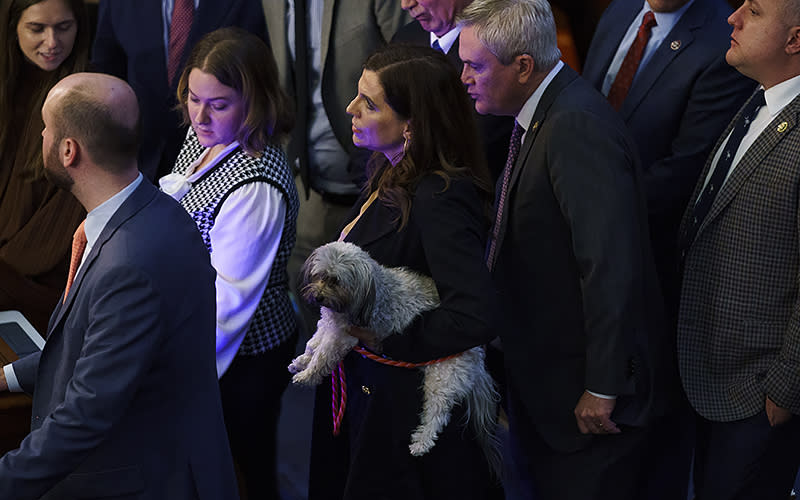 Rep. Nancy Mace (R-S.C.) holds her dog Liberty as the House votes to adjourn following the 11th ballot for Speaker on Jan. 5. <em>Greg Nash</em>