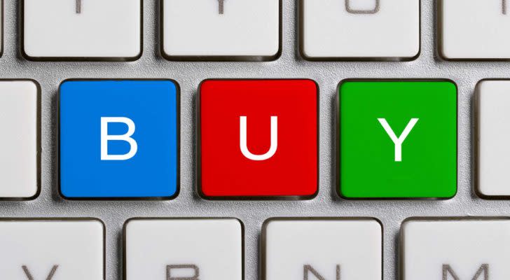 BUY spelled out on a computer keyboard representing stocks to buy