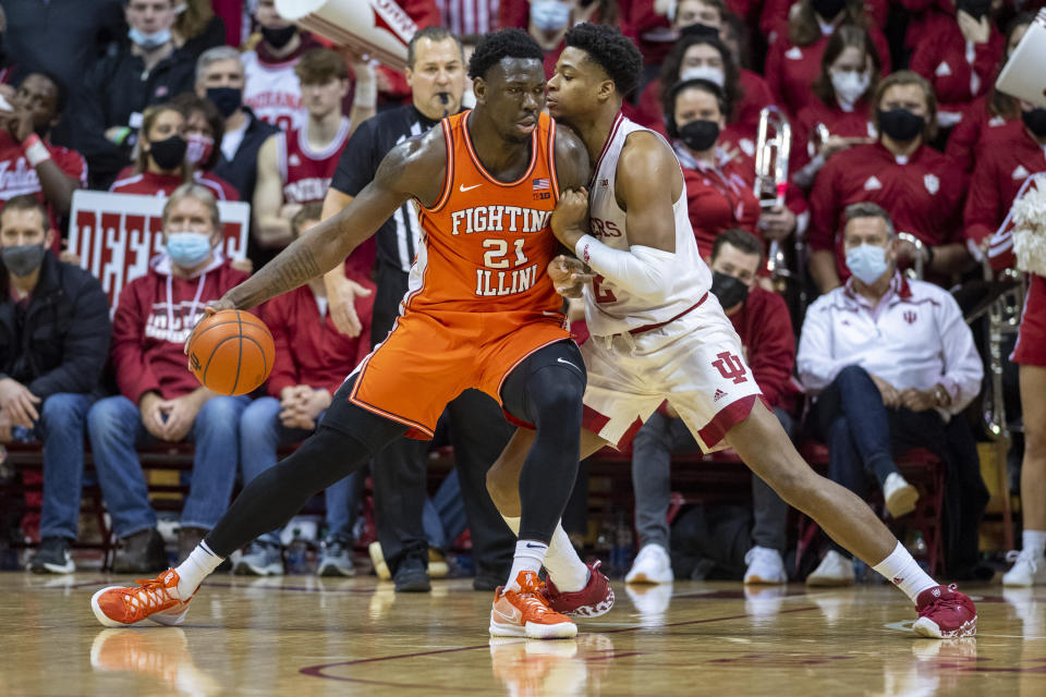 Illinois center Kofi Cockburn (21) works the ball into the defense of Indiana center Michael Durr (2) during the second half of an NCAA college basketball game, Saturday, Feb. 5, 2022, in Bloomington, Ind. (AP Photo/Doug McSchooler)