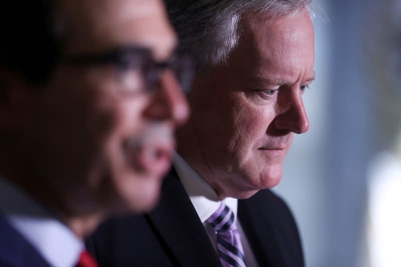 FILE PHOTO: U.S. Treasury Secretary Mnuchin and White House Chief of Staff Meadows speak to reporters after coronavirus relief negotiations with Pelosi and Schumer at the U.S. Capitol in Washington