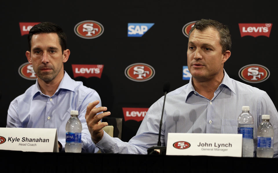 San Francisco 49ers general manager John Lynch, right, gestures beside head coach Kyle Shanahan during an NFL football news conference Friday, March 10, 2017, in Santa Clara, Calif. (AP Photo/Ben Margot)