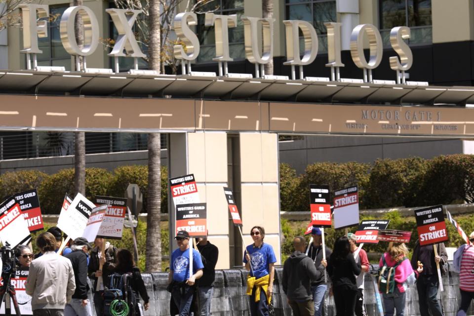 WGA members walk the picket line in front of Fox Studios