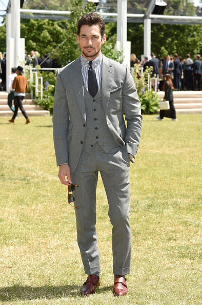 David Gandy, the male model best known for taking his shirt off, might be keeping his clothes on more often these days in favor of designing clothes, but that’s not such a bad thing. At the Burberry show, the Brit looked dapper in a three-piece dark gray suit.