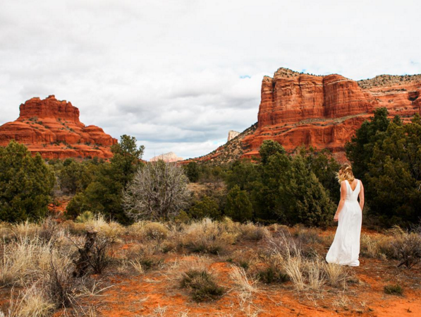 A candid wedding dress photo is even more stunning with Sedona’s dramatic red rocks as a backdrop. 