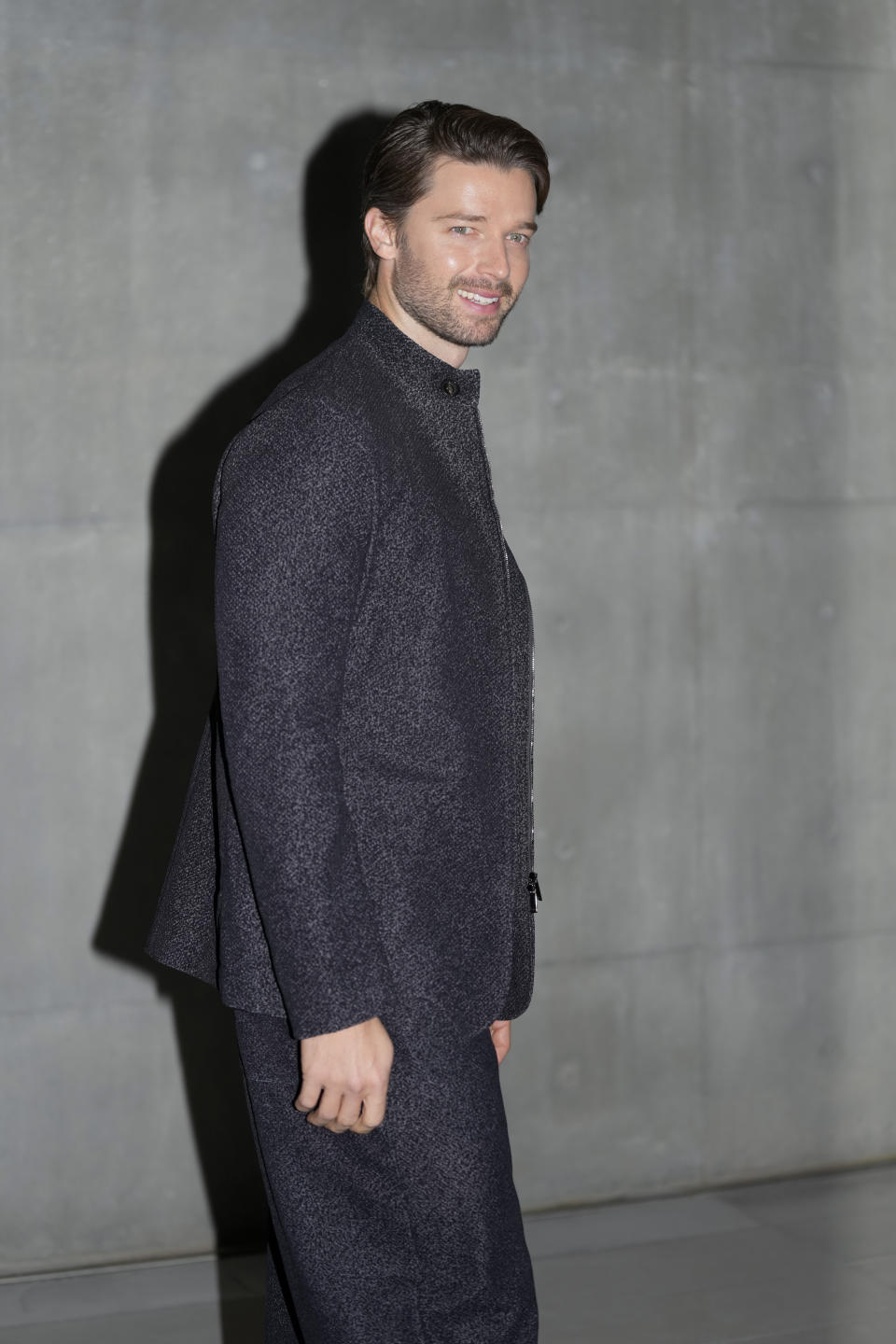 Patrick Schwarzenegger attends the men's Giorgio Armani Fall-Winter 2024-2025 collection, that was presented in Milan, Italy, Saturday, Jan. 13, 2024. (AP Photo/Luca Bruno).