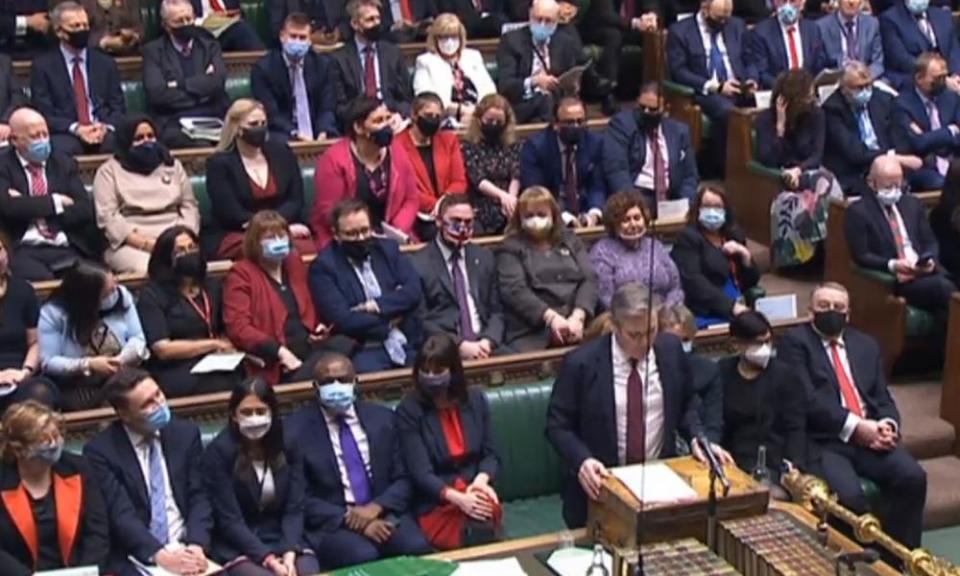 Christian Wakeford sitting on the opposition benches behind Labour leader Keir Starmer on the day he defected.