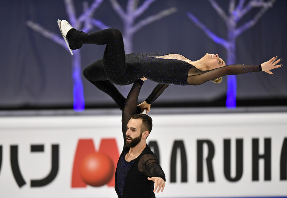 Ashley Cain-Gribble and Timothy LeDuc of the USA perform during the Pairs Short Program at the Figure Skating World Championships in Stockholm, Sweden, Wednesday, March 24, 2021. (AP Photo/Martin Meissner)