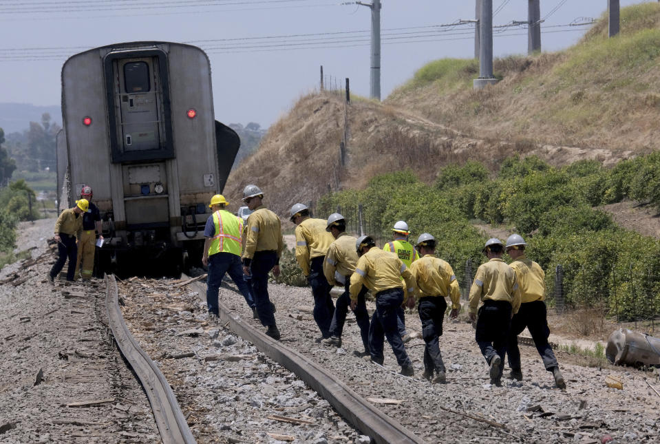 First responders work the scene after a derailed Amtrak train in Moorpark, Calif., on Wednesday, June 28, 2023. Authorities say an Amtrak passenger train carrying 190 passengers derailed after striking a vehicle on tracks in Southern California. Only minor injuries were reported. (Dean Musgrove/The Orange County Register via AP)