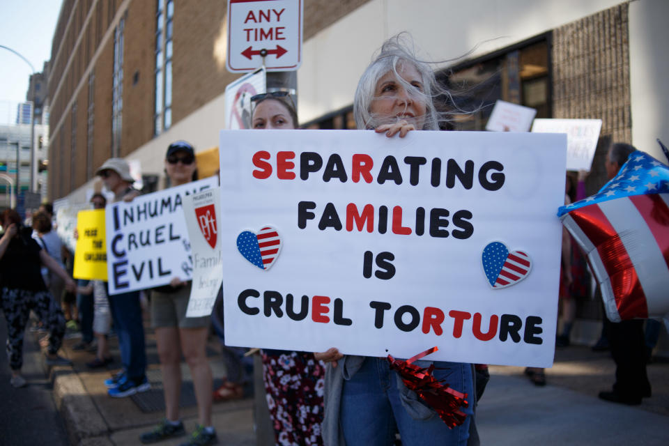 A protester holding a placard during the protest. Protesters participate in a rally organized by Families Belong Together, speaking out against the Trump administration's policies separating immigrant families across from one of the city's Immigration and Customs Enforcement (ICE) offices. (Photo: Pacific Press via Getty Images)