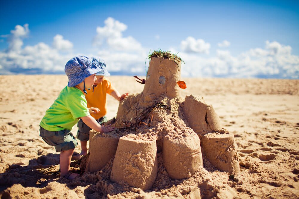 kids building sandcastle