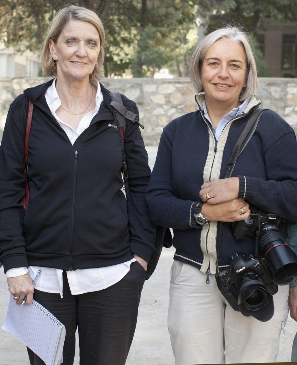 This 2012 photo shows Kathy Gannon, left, Associated Press special correspondent for Afghanistan and Pakistan, and AP photographer Anja Niedringhaus in Afghanistan. An Afghan police commander opened fire Friday, April 4, 2014 on the two journalists inside a security forces base in eastern Afghanistan, killing Niedringhaus and wounding Gannon. (AP Photo)