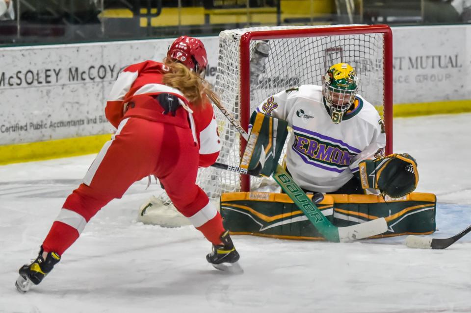 UVM's goalie Jessie McPherson makes a pad save on BU's Clare O'Leary during the Catamounts' game vs the Terriers at Gutterson Fieldhouse earlier this season.