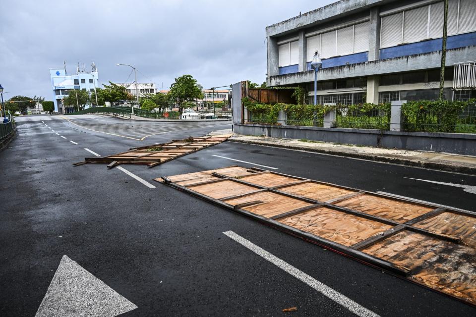 Billboards are seen fallen on the street as hurricane Beryl passes near to Bridgetown, Barbados on July 1, 2024. Hurricane Beryl plowed toward the southeast Caribbean early Monday as officials warned residents to seek shelter ahead of powerful winds and swells expected from the Category 3 storm. (Photo by CHANDAN KHANNA / AFP) (Photo by CHANDAN KHANNA/AFP via Getty Images)