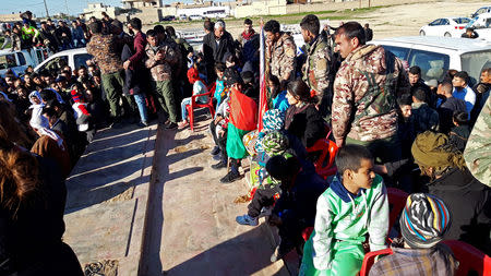 Yazidis survivors are greeted by residents of Sinuni following their release from Islamic State militants in Syria, in Sinuni, Iraq March 1, 2019. REUTERS/Fahed Khodor