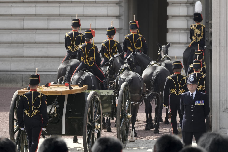 The gun carriage which will transport the coffin of late Queen Elizabeth II in procession to Westminster Hall arrives at Buckingham Place in London, Wednesday, Sept. 14, 2022. The Queen will lie in state in Westminster Hall for four full days before her funeral on Monday Sept. 19. (AP Photo/Vadim Ghirda, Pool)