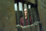 <p>John McCain walks inside the Hoa Lo prison, nicknamed “The Hanoi Hilton” in Hanoi, Vietman, on April 27, 2000, where McCain was kept as a prisoner of war from October 1967 until March 1973. McCain was visiting as Vietnam marked the 25th anniversary of the end of the war. (Photo: David Guttenfelder/AP) </p>