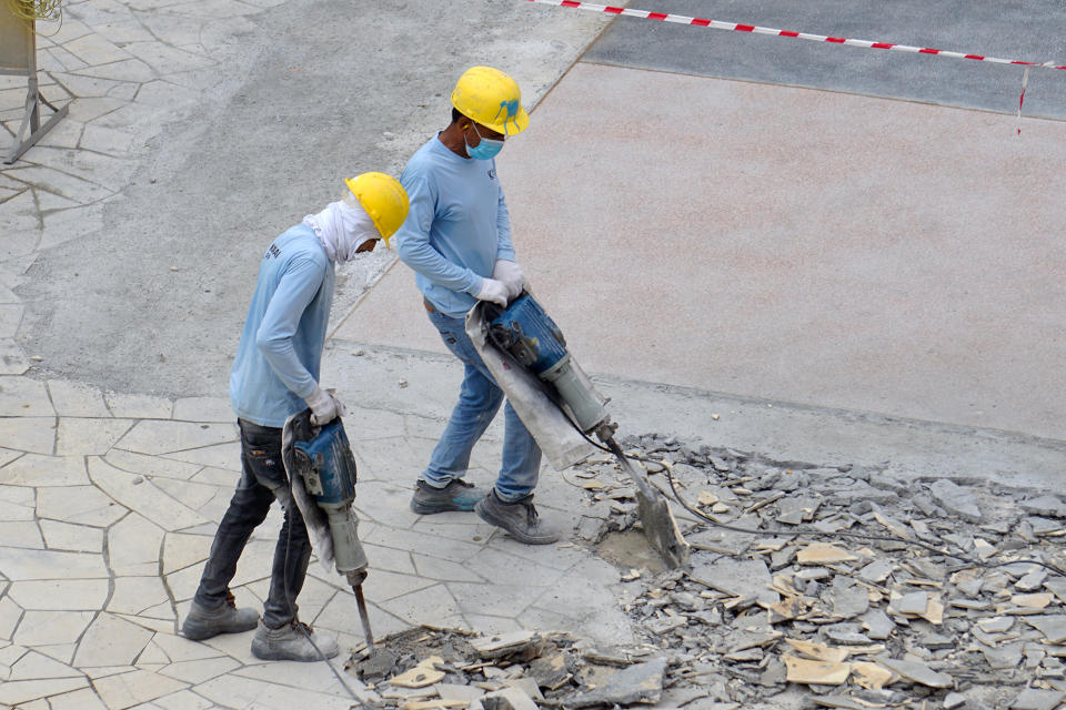 Migrant workers doing construction work in the Queen’s Road area. (PHOTO: Dhany Osman / Yahoo News Singapore)