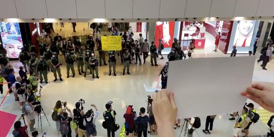 protestsers white signs hong kong