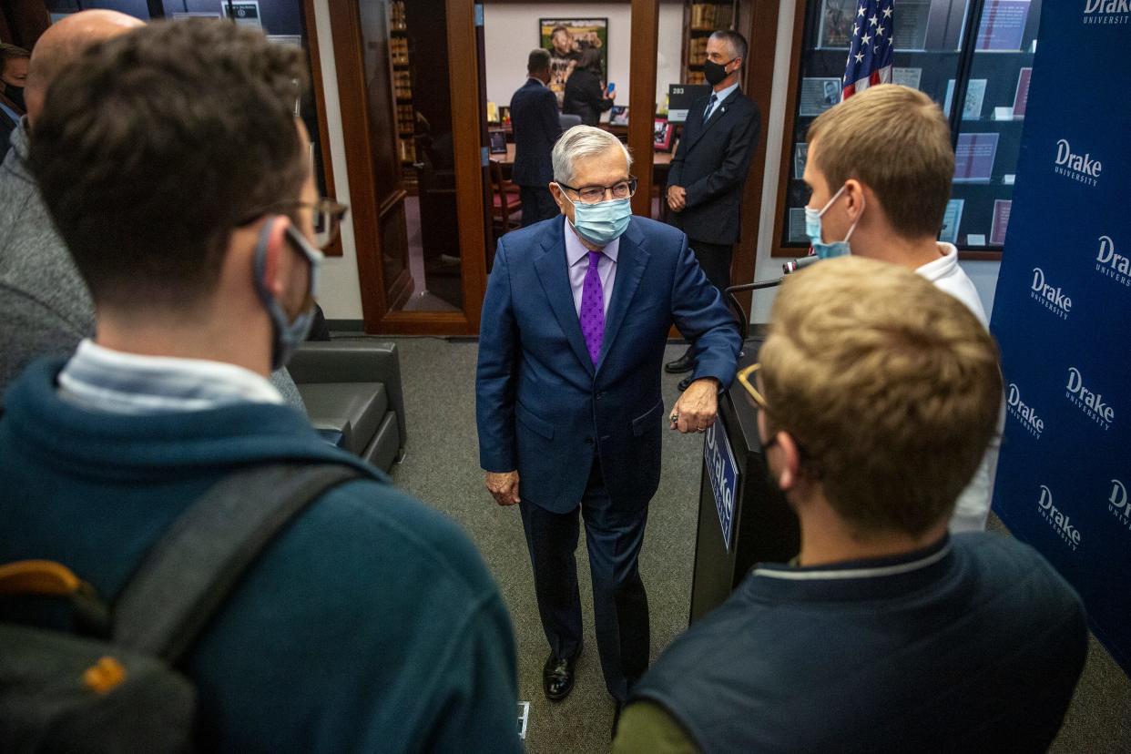 Terry Branstad, former U.S. ambassador to China and governor of Iowa, talks with a group of students after a news conference announcing his new position as ambassador-in-residence at Drake University's law school.