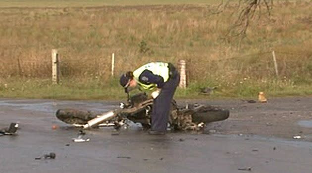 Police inspect the motorcycle wreck