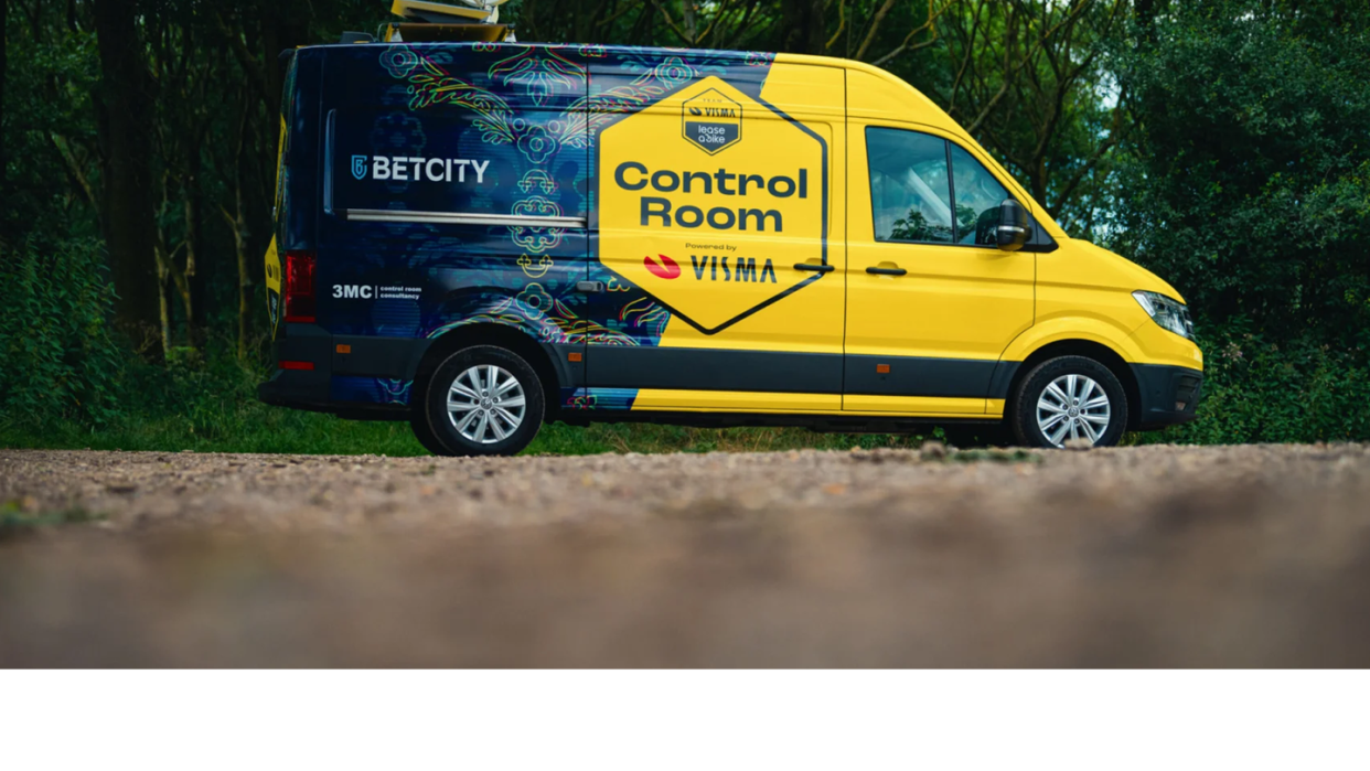 a yellow van with a blue and white sign on it