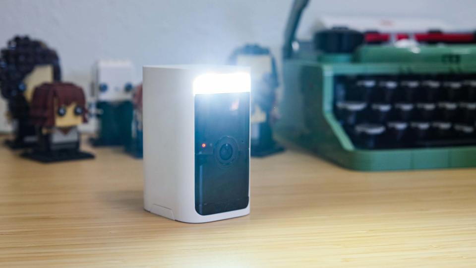 Wyze Battery Cam Pro sitting on desk