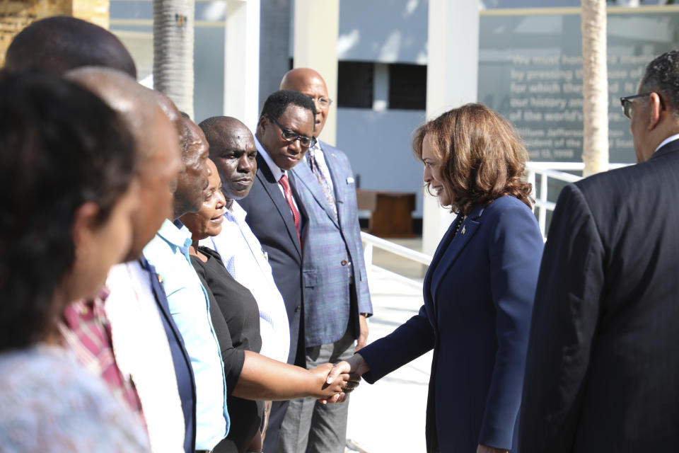 U.S. Vice President Kamala Harris, center, greets survivors of the 1998 bombing of the American Embassy in Tanzania at National Museum and House of Culture in Dar es Salaam, Tanzania, Thursday, March 30, 2023. (Ericky Boniphace/Pool Photo via AP)
