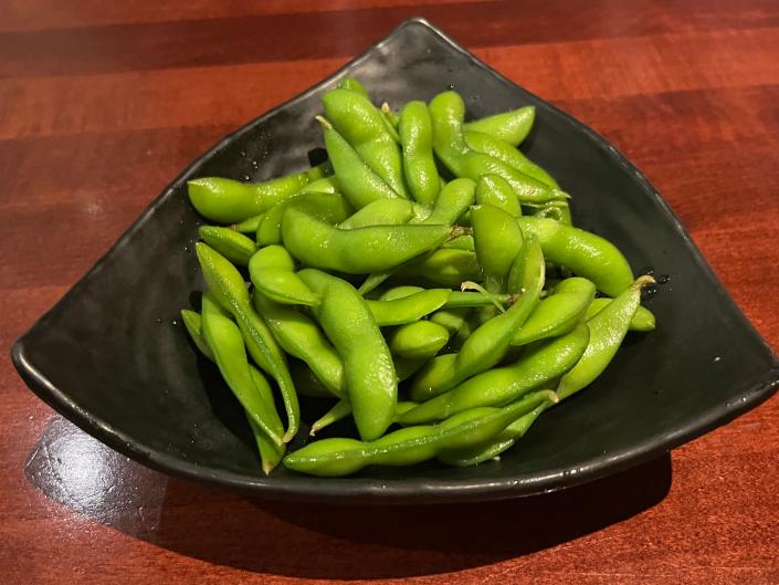 Triangular plate filled with edamame
