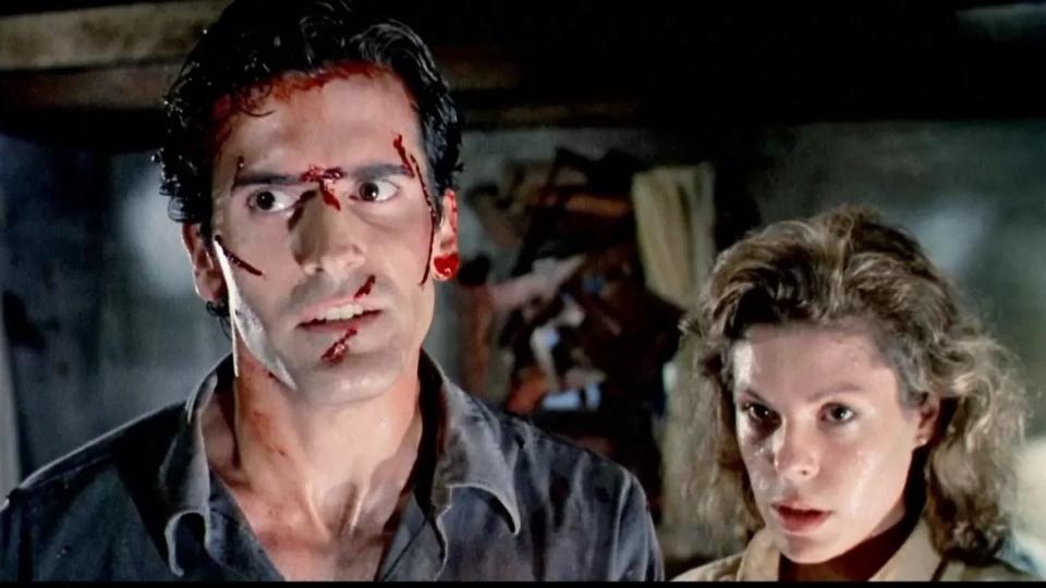 ash has a bloodied face in a scene from 'the evil dead,' a good housekeeping pick for best halloween movies