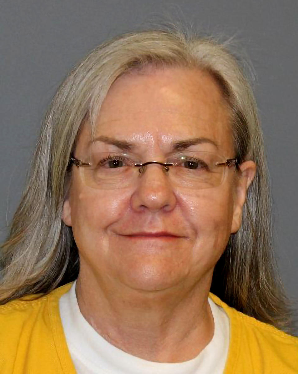This booking photo taken Wednesday, March 9, 2022 and provided by the Mesa County, Colo., Sheriff's Office shows Mesa County Deputy Clerk Belinda Knisley. A grand jury in Colorado has indicted Knisley and Mesa County Clerk Tina Peters, who has sowed doubt about the 2020 presidential election, alleging they were part of a scheme to breach voting system technology that is used across the country. (Mesa County Sheriff's Office via AP)