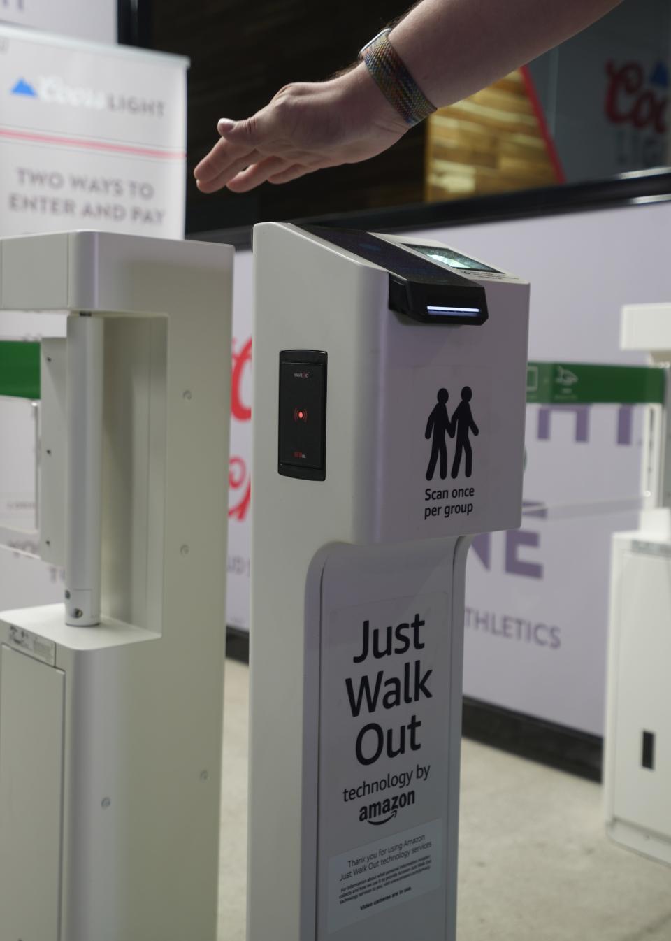 Mike Muffler enters a kiosk that is part of Amazon's Just Walk Out technology designed to eliminate checkout lines. The technology detects what shoppers take from or return to the shelves and creates a virtual shopping session. Guests can grab what they need and leave the store without having to wait in line to checkout.