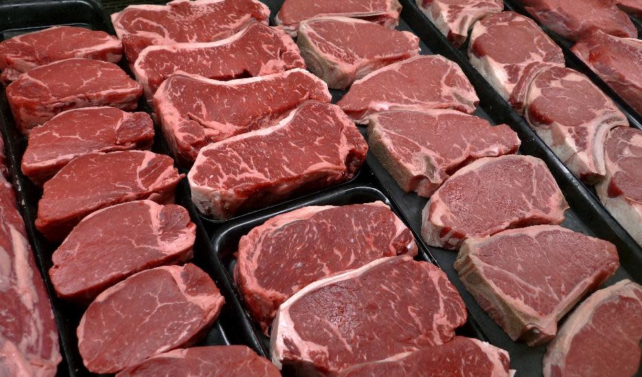 FILE - This Jan. 18, 2010 file photo shows steaks and other beef products displayed for sale at a grocery store in McLean, Va. Eight meat and livestock groups sued the U.S. Department of Agriculture in federal court in Washington Monday, July, 9, 2013, to block implementation of a new labeling rule that requires meat labels to detail where animals grown for meat were born, raised and slaughtered. (AP Photo/J. Scott Applewhite, file)