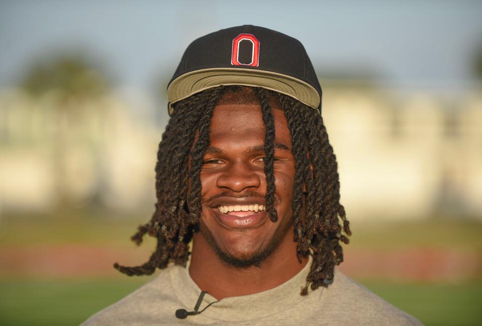 Vero Beach High School linebacker T.J. Alford announces his commitment to play football for Ohio State while sitting with his family inside the school's Citrus Bowl stadium on Saturday, March 30, 2024, in Vero Beach.