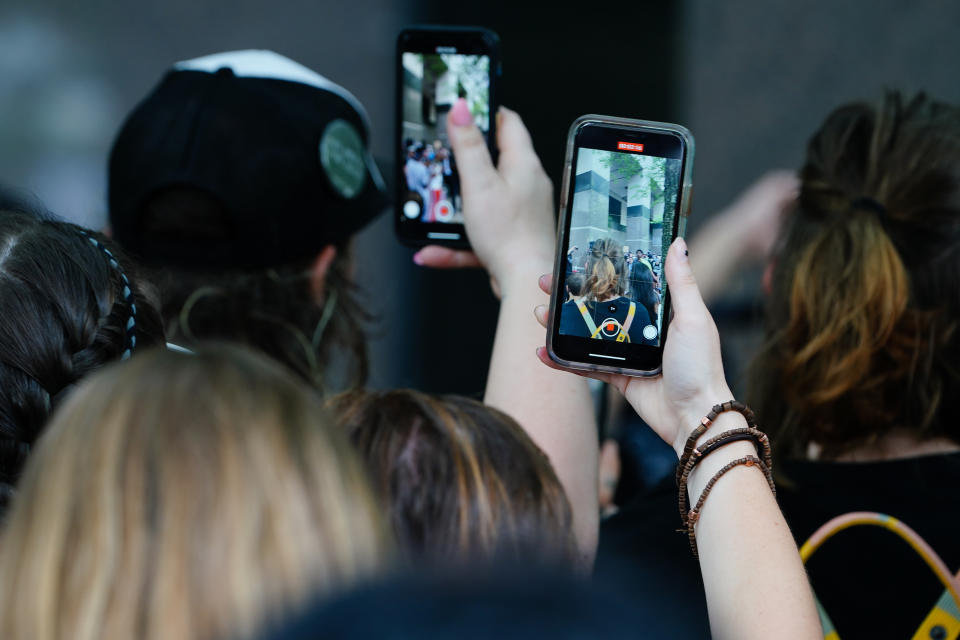 People use their cell phones to record a speaker during a protest over the death of George Floyd while in Minneapolis police custody on June 6, 2020 in Atlanta, United States. (Elijah Nouvelage/Getty Images)