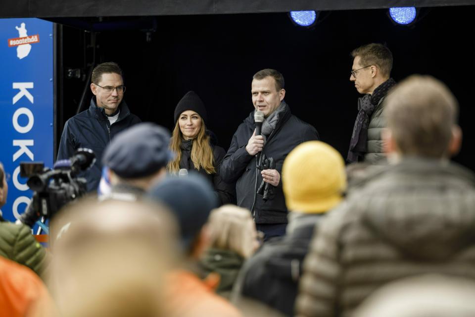 The chairman of the National Coaltion Party and parliamentary candidate Petteri Orpo, center, with Vice-President for Jobs, Growth, Investment and Competitiveness of European Commission Jyrki Katainen, left, and Vice President of European Investment Bank Alexander Stubb, right, campaign for parliamentary elections in Helsinki, Finland, on Saturday, April 13, 2019. The election day of the Finnish parliamentary elections is on Sunday. (Seppo Samuli/Lehtikuva via AP)