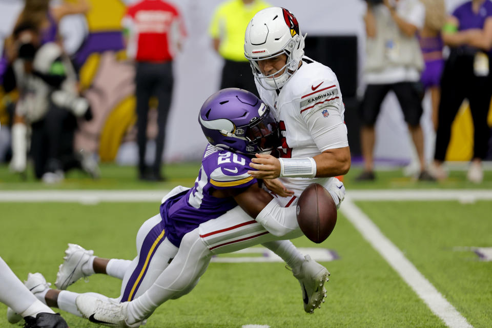 Minnesota Vikings safety Jay Ward (20) sacks Arizona Cardinals quarterback Clayton Tune for a fumble during the first half of an NFL preseason football game, Saturday, Aug. 26, 2023, in Minneapolis. The Vikings recovered the football on the play. (AP Photo/Bruce Kluckhohn)