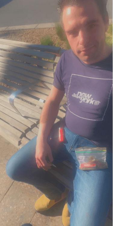 Pictured is a man seated on a bench in Frankston, Melboourne.