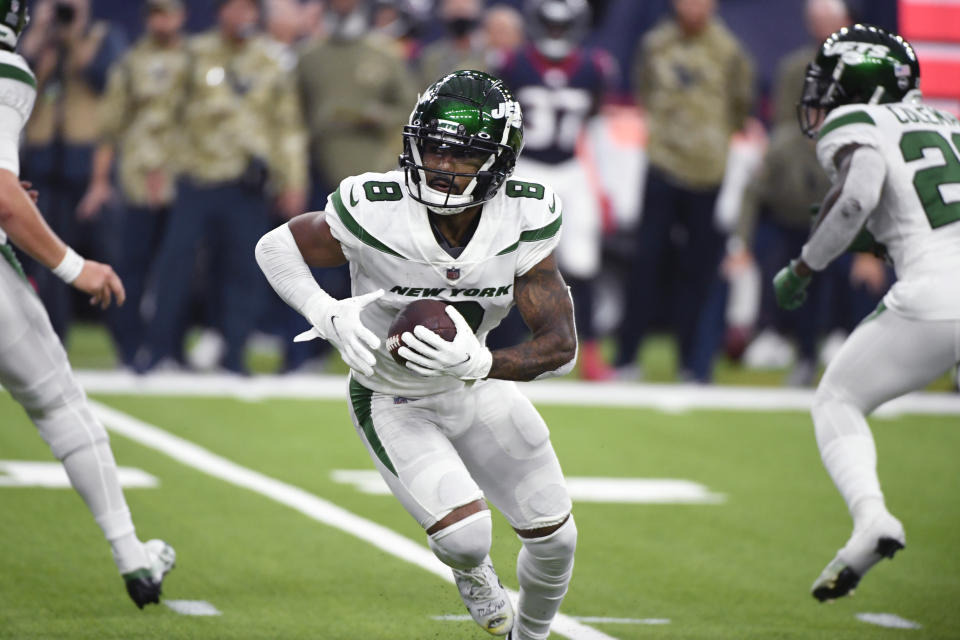 New York Jets wide receiver Elijah Moore (8) carries in the second half of an NFL football game against the Houston Texans in Houston, Sunday, Nov. 28, 2021. (AP Photo/Justin Rex)