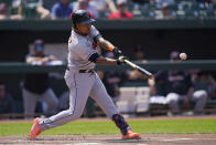 Cleveland Guardians' Jose Ramirez hits a double off Baltimore Orioles pitcher Keegan Akin during the first inning of a baseball game, Wednesday, May 31, 2023, in Baltimore. Guardians' Myles Straw scored on the double. (AP Photo/Julio Cortez)