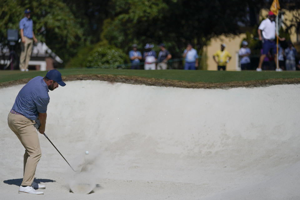 Cameron Young hits out of the bunker on the third hole during practice for the Presidents Cup golf tournament at the Quail Hollow Club, Wednesday, Sept. 21, 2022, in Charlotte, N.C. (AP Photo/Julio Cortez)
