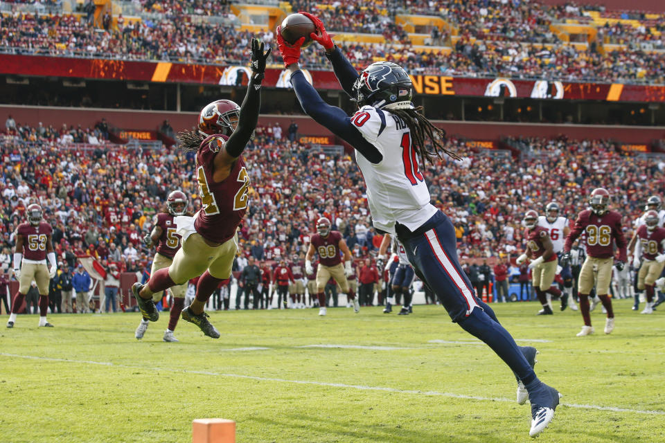 <p>Houston Texans wide receiver DeAndre Hopkins (10) pulls in a touchdown pass under pressure from Washington Redskins cornerback Josh Norman (24) during the first half of an NFL football game, Sunday, Nov. 18, 2018 in Landover, Md. (AP Photo/Alex Brandon) </p>